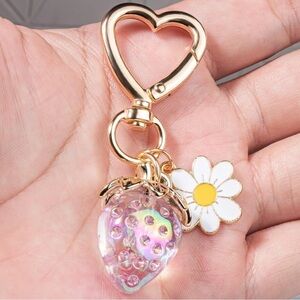 Strawberry iridescent color berry bag charm w/ white daisy and gold hear…